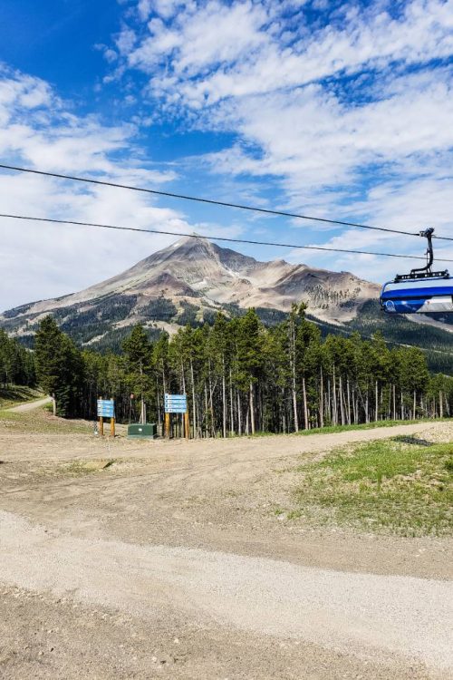 A chairlift passing by Lone Peak in Big Sky Montana