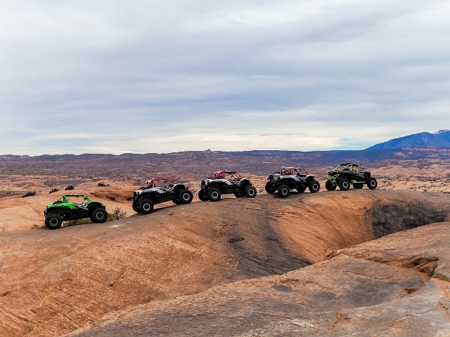5 UTVs lined up on one of the off road trails in Moab